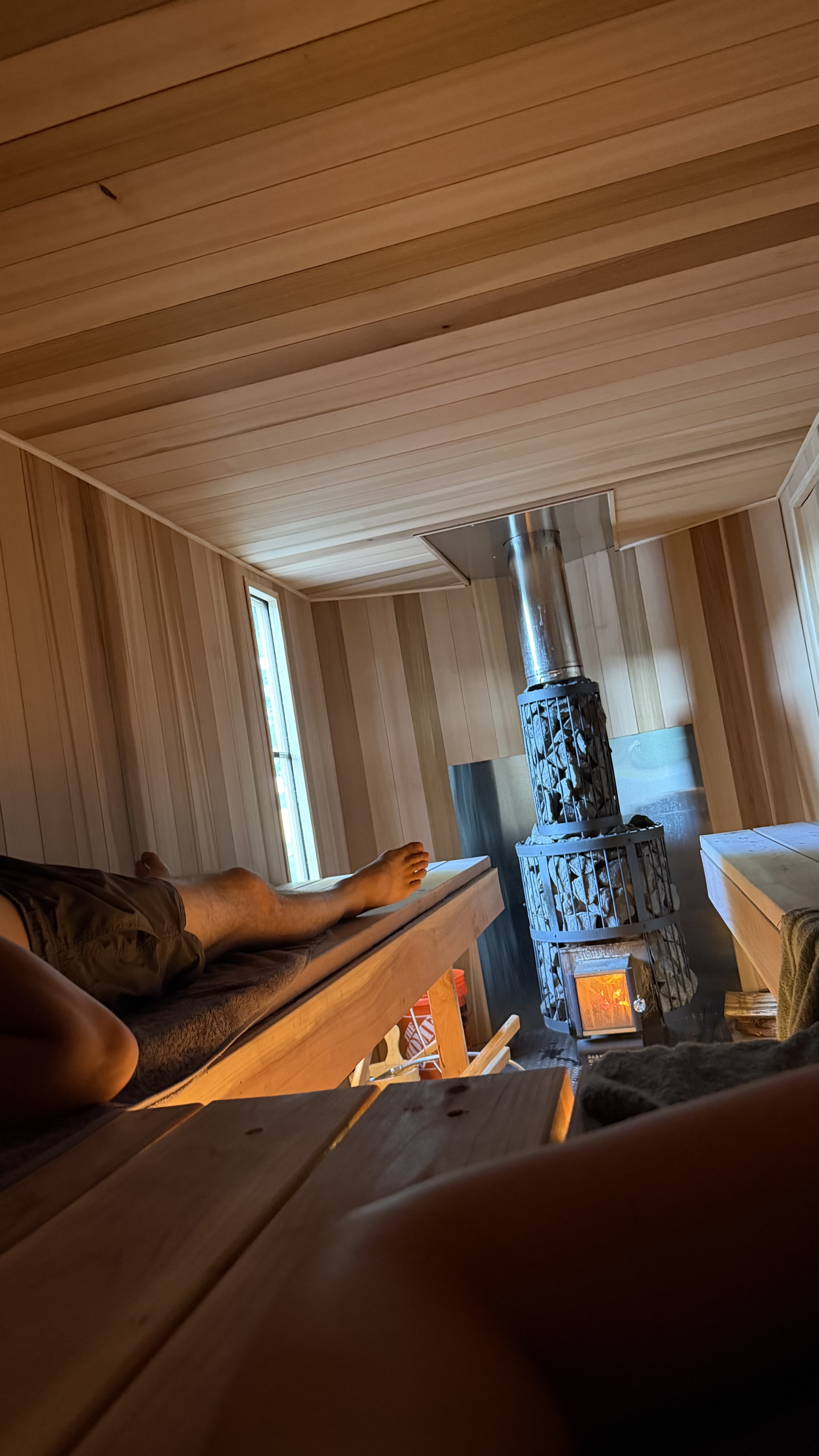 Relaxing by the wood-fired sauna stove